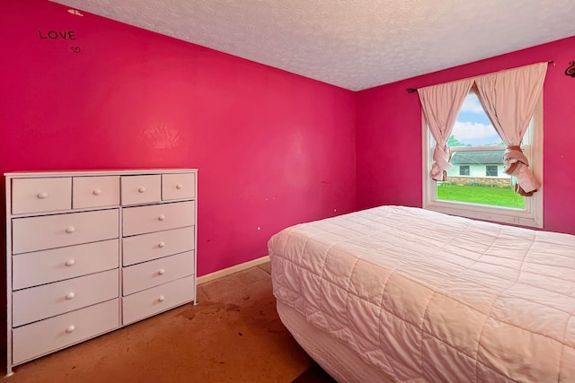6024 Winterberry Dr, Galloway, OH 43119 - bedroom featuring carpet flooring, a textured ceiling, and baseboards