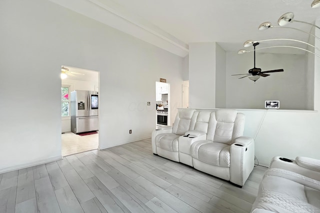 6024 Winterberry Dr, Galloway, OH 43119 - living area with a ceiling fan, light wood-type flooring, and high vaulted ceiling