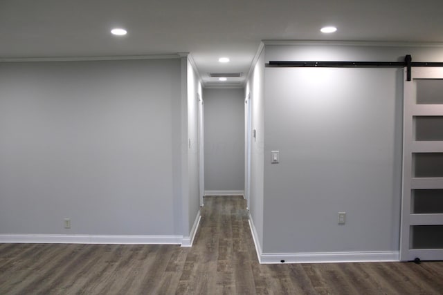 2075 Rankin Ave, Columbus, OH 43219 - spare room with a barn door, ornamental molding, dark wood finished floors, baseboards, and recessed lighting