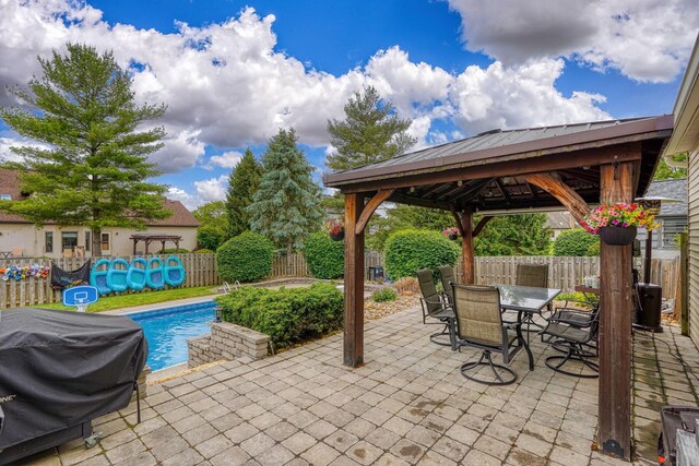 12179 Woodrow Ln, Pickerington, OH 43147 - fenced backyard featuring a gazebo, grilling area, a patio area, and outdoor dining space