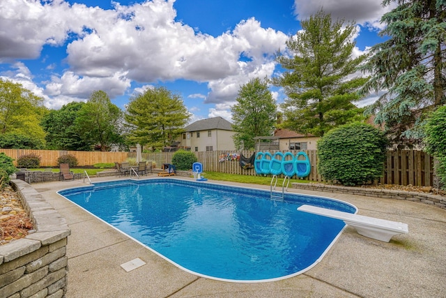12179 Woodrow Ln, Pickerington, OH 43147 - view of swimming pool with a patio, a fenced backyard, and a diving board