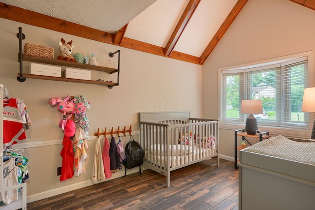 12179 Woodrow Ln, Pickerington, OH 43147 - bedroom featuring dark wood-style floors, baseboards, and a nursery area