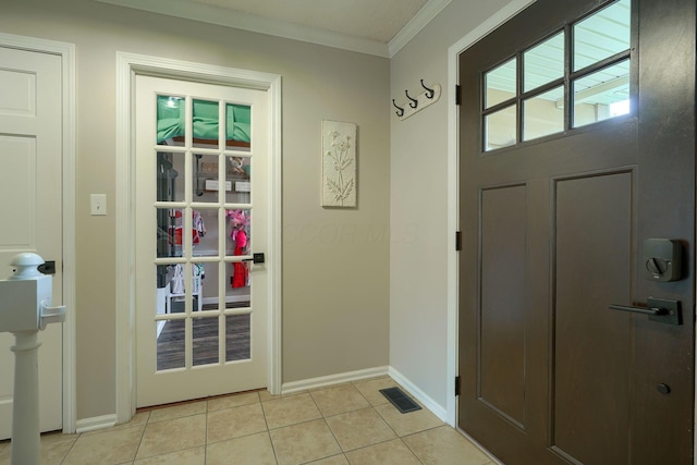 12179 Woodrow Ln, Pickerington, OH 43147 - doorway to outside featuring crown molding, light tile patterned floors, and baseboards