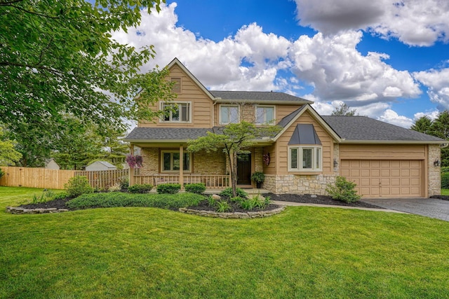 12179 Woodrow Ln, Pickerington, OH 43147 - view of front of house featuring driveway, a porch, a garage, and stone siding