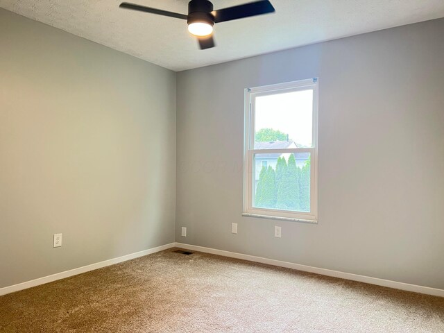 507 Warwick Ln, Pickerington, OH 43147 - unfurnished room featuring a ceiling fan, light colored carpet, baseboards, and a textured ceiling