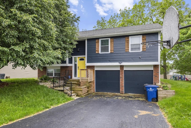 7263 Saddletree Ct, Reynoldsburg, OH 43068 - split foyer home with a garage, brick siding, asphalt driveway, and a front lawn