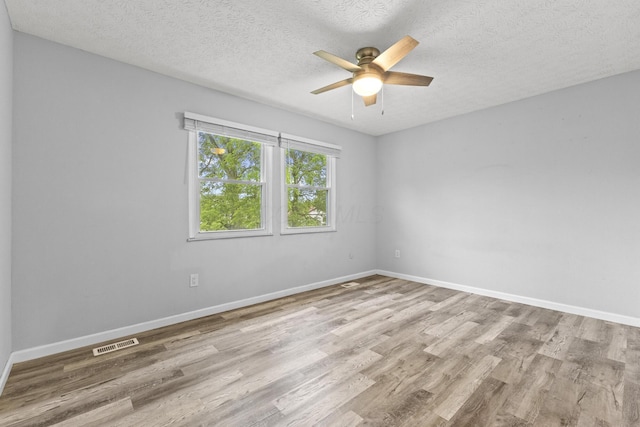 7263 Saddletree Ct, Reynoldsburg, OH 43068 - spare room featuring wood finished floors, ceiling fan, a textured ceiling, and baseboards