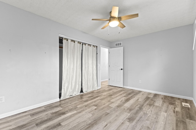7263 Saddletree Ct, Reynoldsburg, OH 43068 - unfurnished bedroom featuring baseboards, wood finished floors, a closet, and ceiling fan