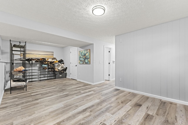 7263 Saddletree Ct, Reynoldsburg, OH 43068 - empty room with wood finished floors, a textured ceiling, and baseboards