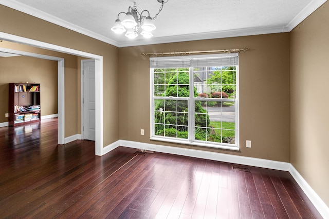 8699 Lazelle Commons Dr, Lewis Center, OH 43035 - unfurnished room with a chandelier, ornamental molding, baseboards, dark wood finished floors, and a textured ceiling