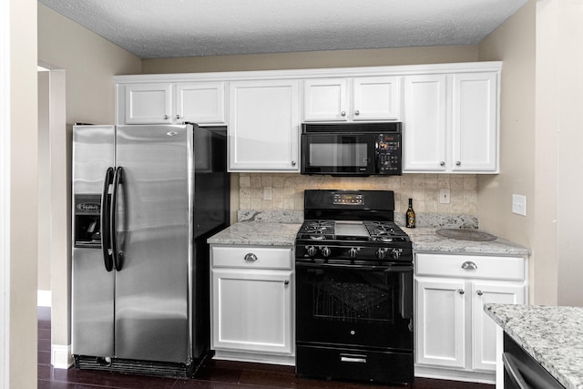8699 Lazelle Commons Dr, Lewis Center, OH 43035 - kitchen with black appliances, white cabinets, backsplash, and light stone countertops