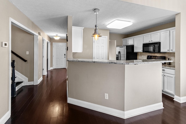 8699 Lazelle Commons Dr, Lewis Center, OH 43035 - kitchen featuring black microwave, stainless steel refrigerator with ice dispenser, white cabinets, baseboards, and light stone counters