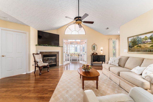 6681 Lakeview Cir, Canal Winchester, OH 43110 - living room featuring wood finished floors, ceiling fan, plenty of natural light, a textured ceiling, and a fireplace