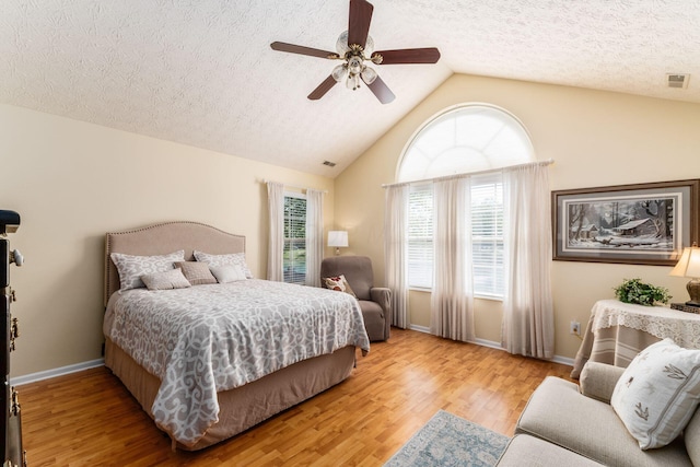 6681 Lakeview Cir, Canal Winchester, OH 43110 - bedroom with light wood-style flooring, a textured ceiling, lofted ceiling, a ceiling fan, and baseboards