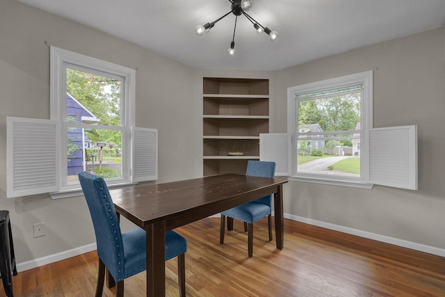198 Loveman Ave, Worthington, OH 43085 - dining space featuring baseboards, wood finished floors, built in shelves, and an office area