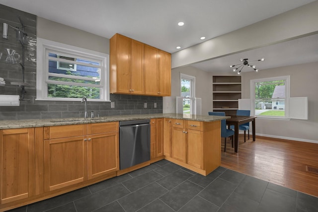 198 Loveman Ave, Worthington, OH 43085 - kitchen with dishwasher, a sink, a peninsula, backsplash, and recessed lighting