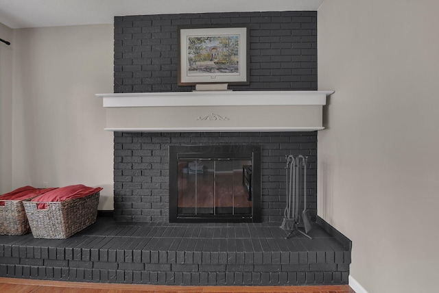 198 Loveman Ave, Worthington, OH 43085 - detailed view of a fireplace, wood finished floors, and baseboards