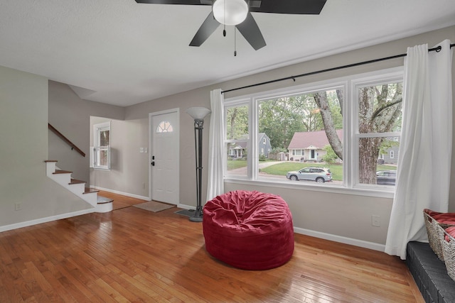 198 Loveman Ave, Worthington, OH 43085 - foyer entrance with wood-type flooring, baseboards, ceiling fan, and stairs