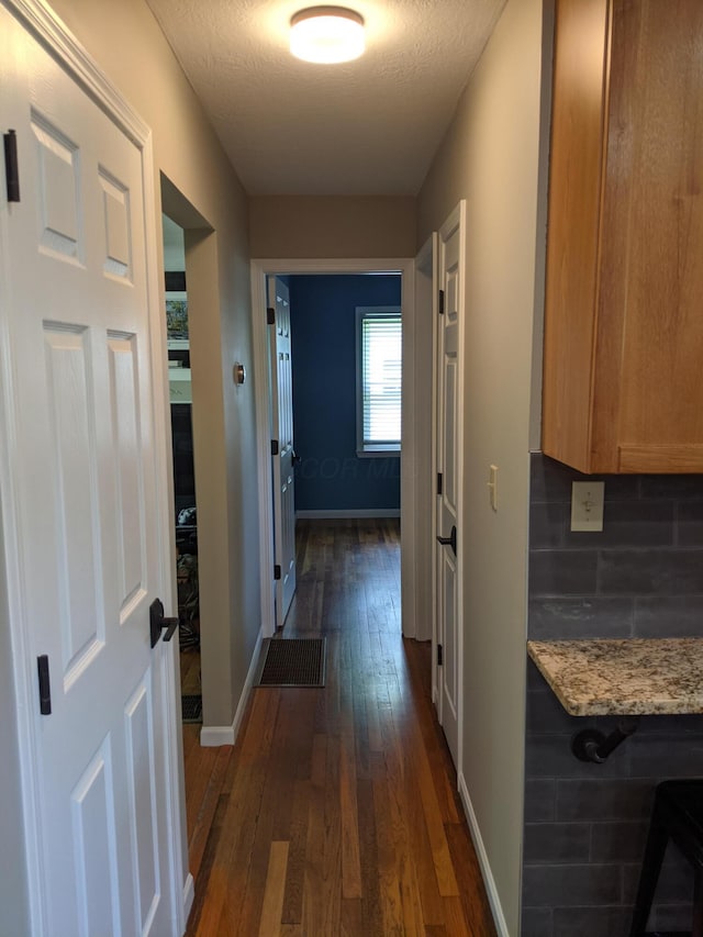 198 Loveman Ave, Worthington, OH 43085 - corridor with dark wood-style floors and baseboards