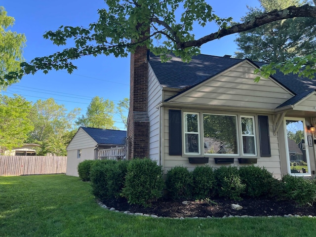 198 Loveman Ave, Worthington, OH 43085 - view of side of property featuring a chimney and roof with shingles