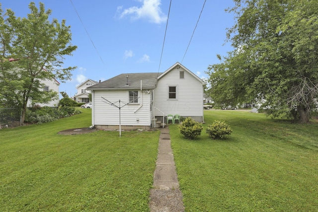 936 Washington Ave, Lancaster, OH 43130 - rear view of property with a yard and a shingled roof