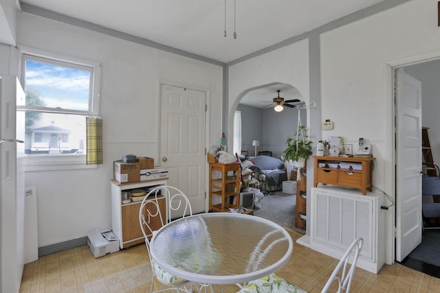 936 Washington Ave, Lancaster, OH 43130 - dining room with ceiling fan, light floors, and arched walkways