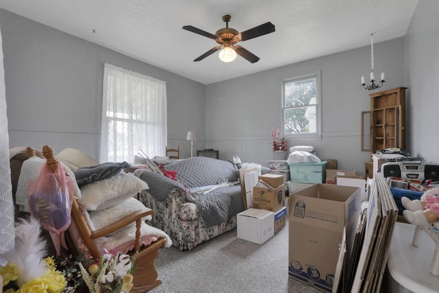 936 Washington Ave, Lancaster, OH 43130 - carpeted bedroom with a chandelier, a wainscoted wall, and a ceiling fan