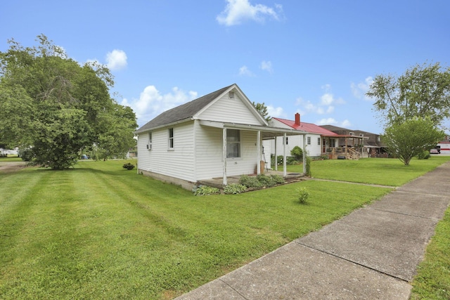936 Washington Ave, Lancaster, OH 43130 - view of front facade featuring a front lawn, a chimney, and covered porch