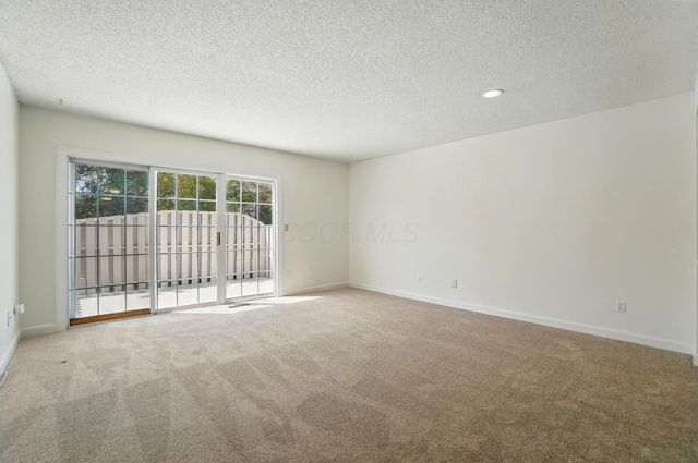 2511 Gardenia Dr Unit 76A, Columbus, OH 43235 - carpeted empty room featuring a textured ceiling and baseboards