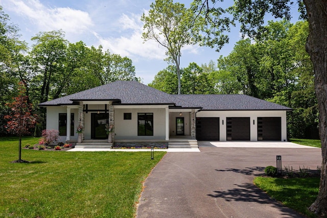 8159 Riverside Dr, Powell, OH 43065 - prairie-style house featuring driveway, a garage, stucco siding, a front yard, and a shingled roof