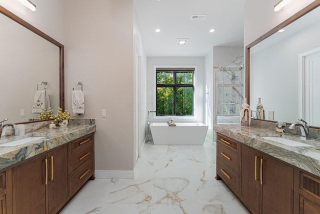 8159 Riverside Dr, Powell, OH 43065 - bathroom featuring two vanities, a marble finish shower, recessed lighting, a freestanding bath, and baseboards