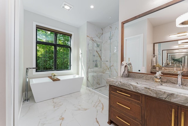 8159 Riverside Dr, Powell, OH 43065 - full bath with a marble finish shower, a freestanding bath, vanity, recessed lighting, and marble finish flooring
