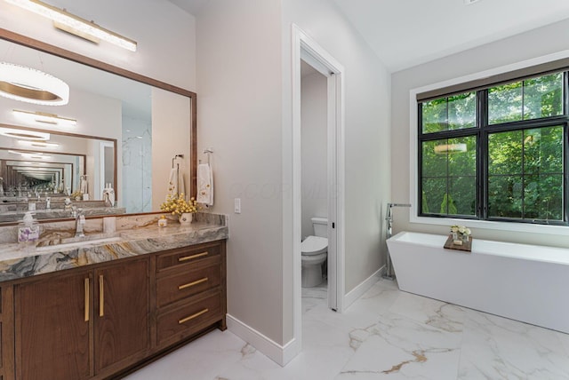 8159 Riverside Dr, Powell, OH 43065 - bathroom with baseboards, a freestanding bath, vanity, and marble finish floors