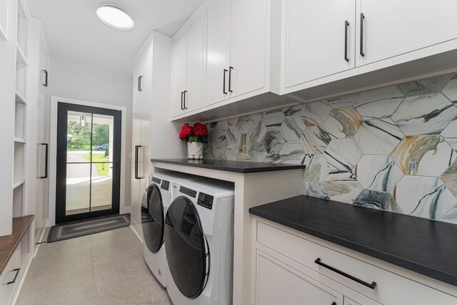 8159 Riverside Dr, Powell, OH 43065 - laundry area featuring separate washer and dryer, cabinet space, and light tile patterned floors