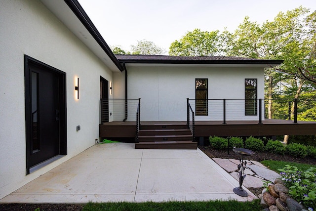 8159 Riverside Dr, Powell, OH 43065 - back of property with a patio, a deck, and stucco siding