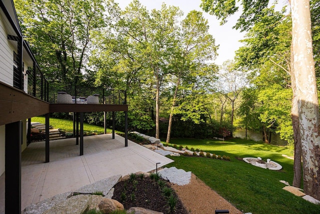 8159 Riverside Dr, Powell, OH 43065 - view of grassy yard with a patio and a wooden deck