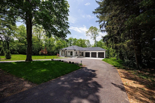 8159 Riverside Dr, Powell, OH 43065 - single story home featuring a garage, driveway, and a front lawn