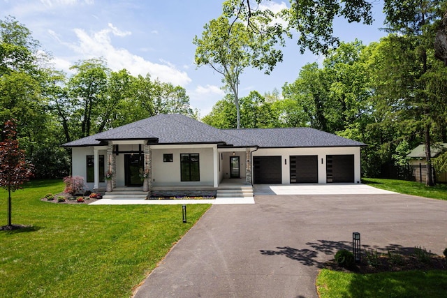 8159 Riverside Dr, Powell, OH 43065 - prairie-style house with driveway, stucco siding, a garage, a front lawn, and a shingled roof