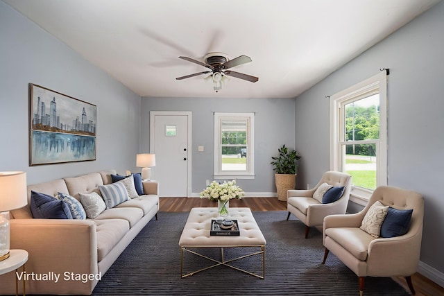 4469 Lancaster Ave, Columbus, OH 43207 - living area featuring ceiling fan and dark wood-style flooring