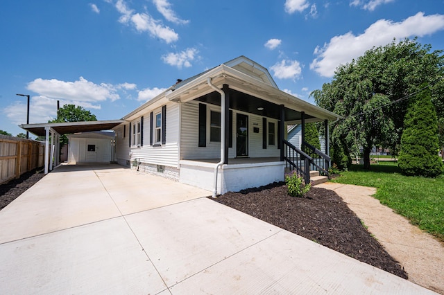 4469 Lancaster Ave, Columbus, OH 43207 - manufactured / mobile home with concrete driveway, covered porch, and an attached carport