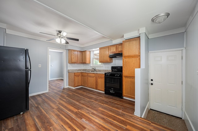 4469 Lancaster Ave, Columbus, OH 43207 - kitchen with black appliances, under cabinet range hood, dark wood finished floors, and a ceiling fan