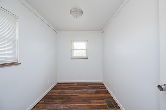 4469 Lancaster Ave, Columbus, OH 43207 - empty room featuring dark wood-style flooring and crown molding