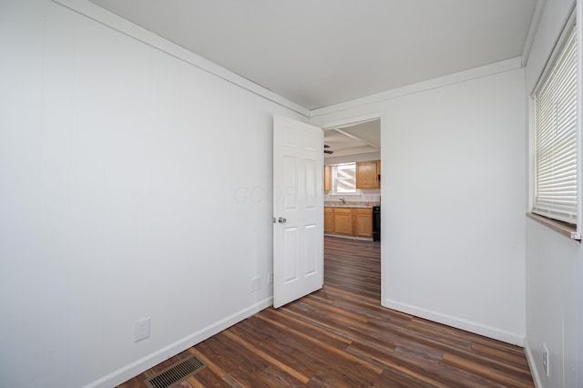 4469 Lancaster Ave, Columbus, OH 43207 - empty room with dark wood-style flooring and baseboards