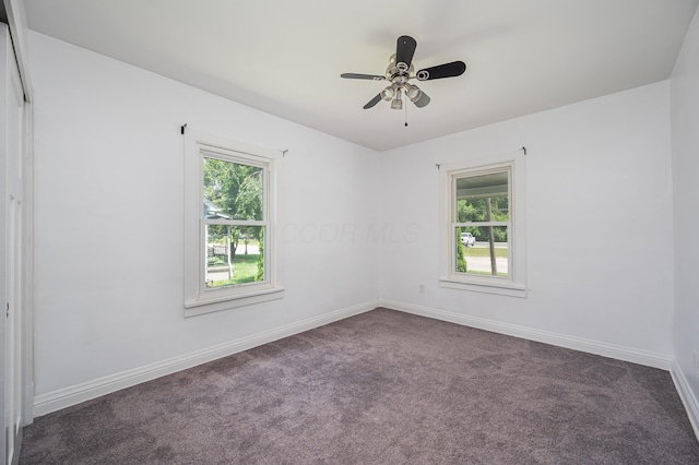 4469 Lancaster Ave, Columbus, OH 43207 - spare room with healthy amount of natural light, dark carpet, and ceiling fan