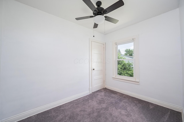 4469 Lancaster Ave, Columbus, OH 43207 - empty room with dark colored carpet and a ceiling fan