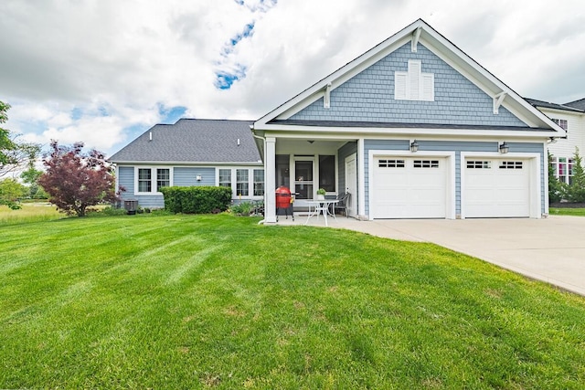 10641 Arrowwood Dr, Plain City, OH 43064 - view of front of home with concrete driveway, a front yard, and an attached garage