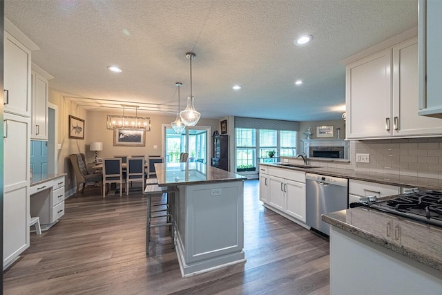 10641 Arrowwood Dr, Plain City, OH 43064 - kitchen with dishwasher, a sink, recessed lighting, white cabinetry, and decorative backsplash