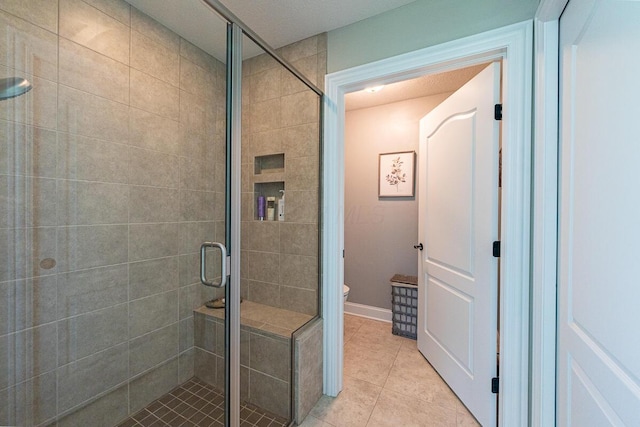 10641 Arrowwood Dr, Plain City, OH 43064 - full bathroom featuring a shower stall, tile patterned floors, and toilet