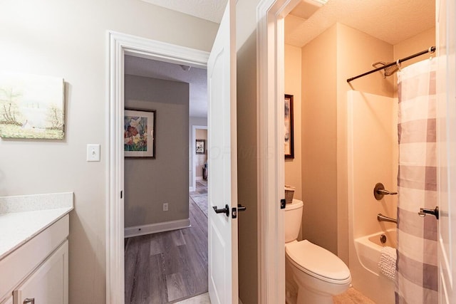 10641 Arrowwood Dr, Plain City, OH 43064 - bathroom with vanity, toilet, wood finished floors, and shower / bath combo
