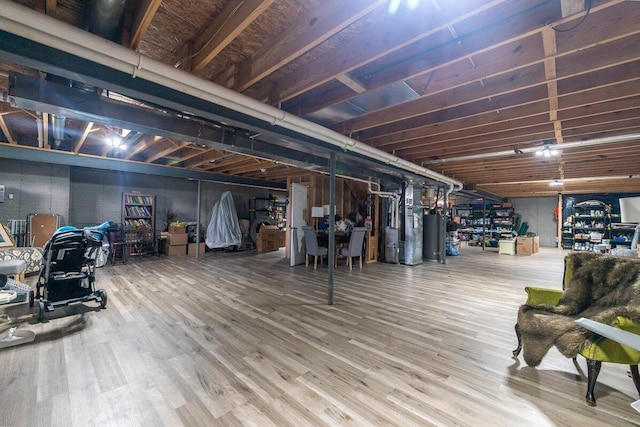 10641 Arrowwood Dr, Plain City, OH 43064 - unfinished basement with wood finished floors and water heater